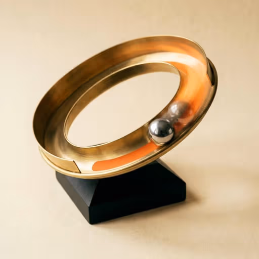Wire: a kinetic brass ring sculpture with a steel ball rolling along its inner track