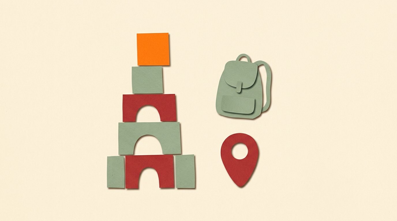 Paper cutout collage of a building-block tower with a bright orange top block, a small backpack, and a map pin on warm cream.